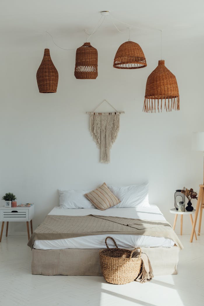 The Art of Drawing Readers In: Your attractive post title goes here Boutique bedroom with wicker decor, macrame art, and a cozy modern design in neutral tones.